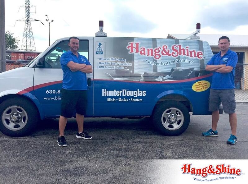 Mike and Jon, the owners of Hang and Shine, beside their van